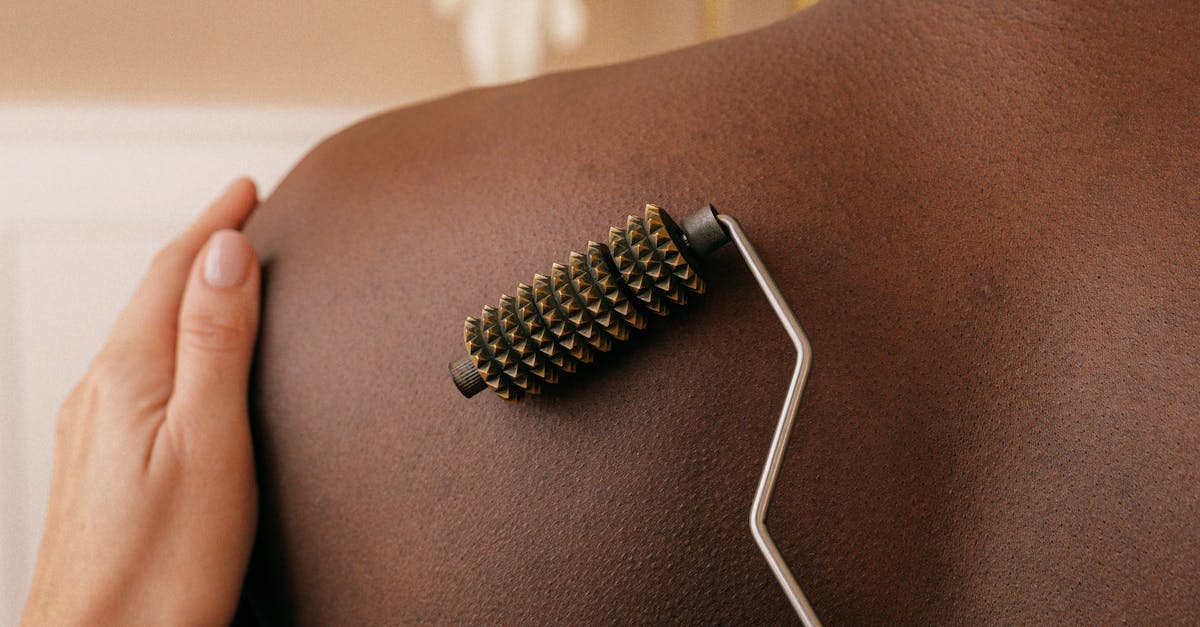 In what situations might you choose to wear clothing during a full body massage, and how can it impact the session?